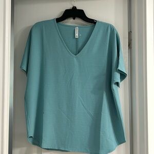 Blueish turquoise boutique top size S